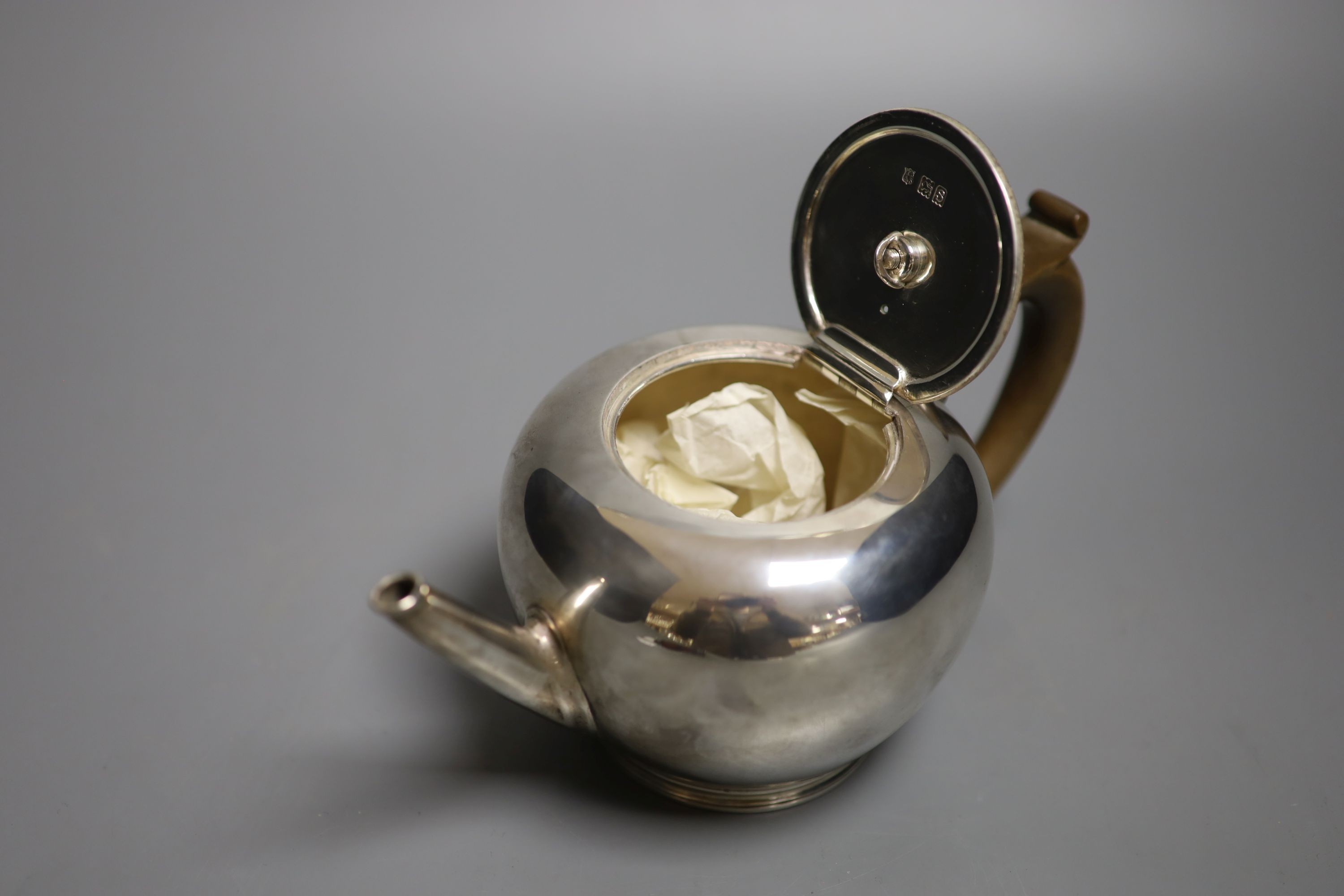 A George V silver bullet shaped teapot, Thomas Bradbury & Sons, London, 1913, gross 13.5oz.